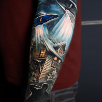 Colorful alien theme tattoo on forearm