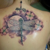 Colorful dogwood flowers and dragonfly tattoo on back