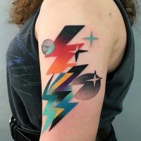 Colorful painted by Mariusz Trubisz upper arm tattoo of planets and lightning
