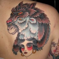 Colorful wolf in sheep skin and gipsy girl tattoo on back