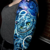Cool Cheshire Cat in blue color tattoo