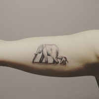 Cool realistic elephant family hangin by tale tattoo on arm