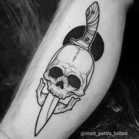 Cool skull with dagger tattoo