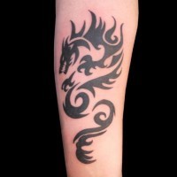 Cool tribal black-ink dragon tattoo on forearm