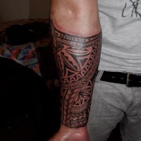 Cool tribal sleeve tattoo for men on forearm