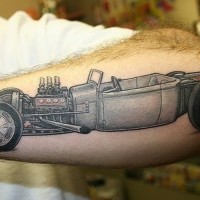 Cool vintage car tattoo on outer forearm