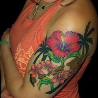 Cool vivid colored exotic flowers and palms tattoo on upper arm