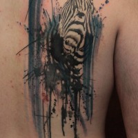 Cool zebra head in black splashes tattoo on back