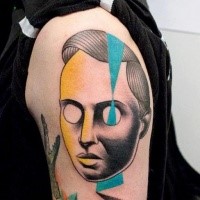 Creepy looking painted by Mariusz Trubisz upper arm tattoo of human like mask