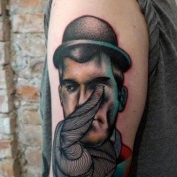 Creepy surrealism style colored upper arm tattoo of man portrait