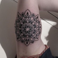 Cute black-ink mandala flower tattoo on upper arm