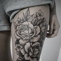 Cute black-ink rose flowers tattoo on thigh