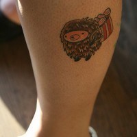 Cute cartoon colorful hedgehog with bag of cakes tattoo on shin