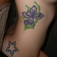 Cute little iris flower tattoo on side