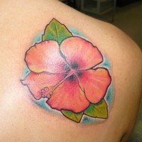Cute pink hawaiian flower tattoo on back