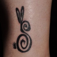 Cute uncolored curled hare tattoo on leg