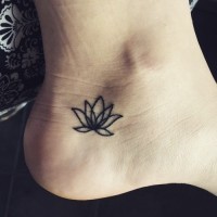 Elegant simple lotus flower tattoo on foot