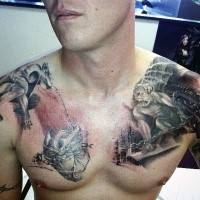 Fantasy style small looking chest tattoo of human heart with gargoyles