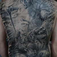 Fierce warrior killing a tiger tattoo on back
