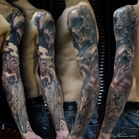 Tatuaggio a manica lunga con teschio, fleur de liss, pistola, albero essiccato