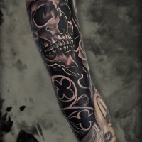 Full sleeve tattoo with skull