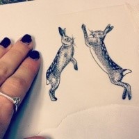 Funny dotwork-style jumping hares tattoo design