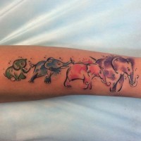 Funny vivid-colored elephant family tattoo on arm