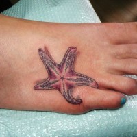 Girly pink starfish tattoo on foot