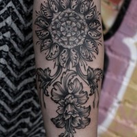 Gorgeous mandala flower on stem tattoo on arm