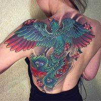 Great big fenix tattoo in green and red colors on upper back and shoulder