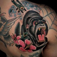 Great black crying gorilla with pink flowers tattoo on back