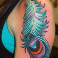 Great blue-colored peacock feather tattoo for women on upper arm