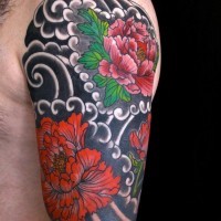 Great colorful japanise flowers on black background tattoo on upper arm