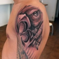 Great crying griffin tattoo for men on upper arm