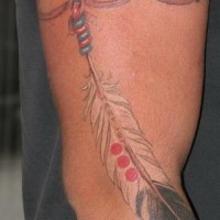 Great eagle feather on rope tattoo on upper arm