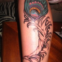 Great fluffy colorful peacock feather tattoo on shin