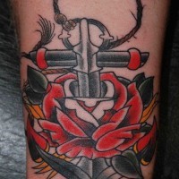 Great old school anchor-sword piercing rose tattoo on shin