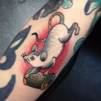 Great old school rodent with spool of thread tattoo on arm