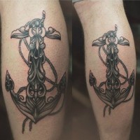 due grandi ancore ornati tatuaggio su stinchi