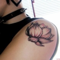 Great small black-and-white lotus flower tattoo on shoulder