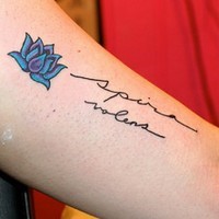 Great small blue lotus flower with quote tattoo on arm