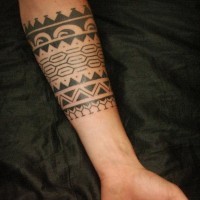 Great tribal black-ink band tattoo on forearm