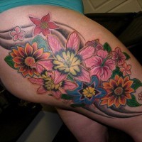 Great vivid-colored flowers tattoo on thigh