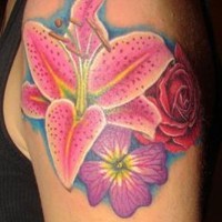 Great vivid-colored hawaiian flowers tattoo on upper arm