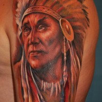 Indian with ornaments tattoo on shoulder