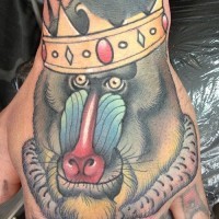 Interesting-designed baboon-king in crown tattoo on hand