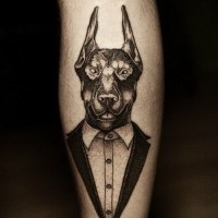 Interesting-designed black-and-white doberman in tuxedo tattoo on arm