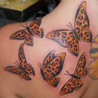 Interesting-designed cheetah butterflies tattoo for girls on shoulder