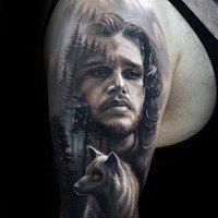 John Snow with wolf tattoo on half sleeve by Arlo