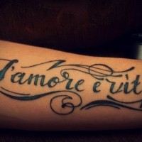 L'amore e vita french quote tattoo on arm